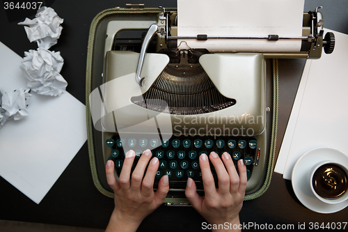 Image of Vintage typewriter and white paper