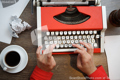 Image of Hands on typing machine