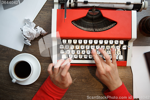 Image of Hands on typing machine