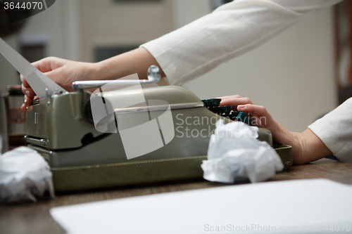 Image of typewriter with crumpled paper