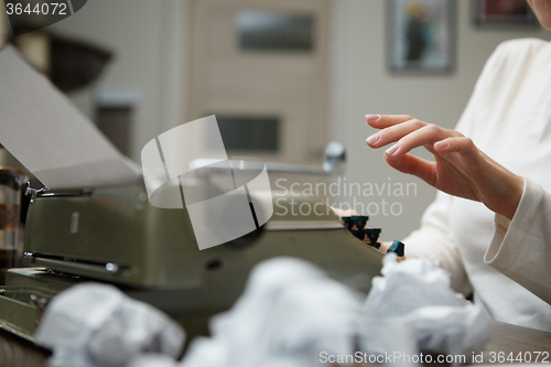 Image of typewriter with crumpled paper