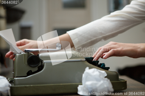 Image of typewriter with crumpled paper