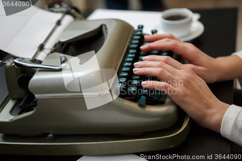 Image of typewriter woman hands