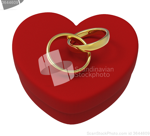 Image of Wedding Rings On Heart Box Show Engagement And Marriage