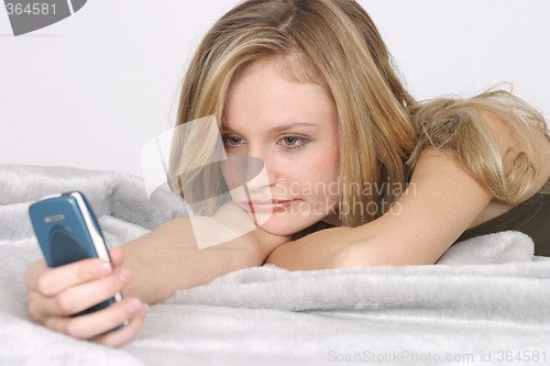Image of Young woman with mobile phone