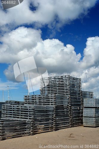 Image of Stacked pallet boards in port
