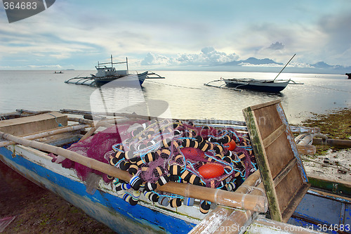 Image of Tropical fishing boat in sunset