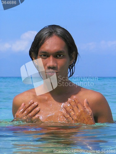 Image of Asian boy portrait in tropical sea.