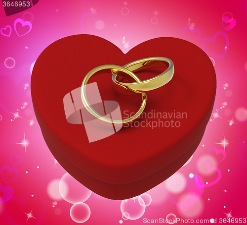 Image of Wedding Rings On Heart Box Mean Romantic Proposal And Vows