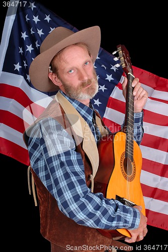 Image of Drunk cowboy with guitar
