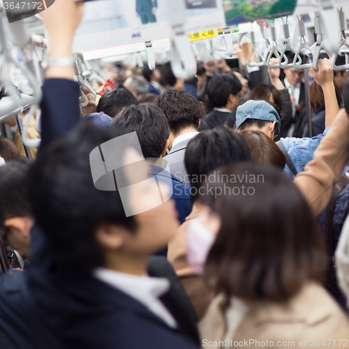 Image of Passengers traveling by Tokyo metro.