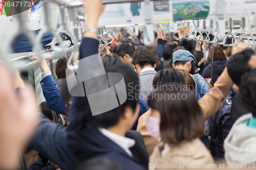 Image of Passengers traveling by Tokyo metro.