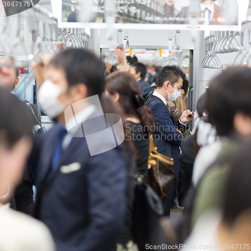 Image of Passengers traveling by Tokyo metro.