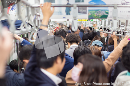 Image of Passengers traveling by Tokyo metro.