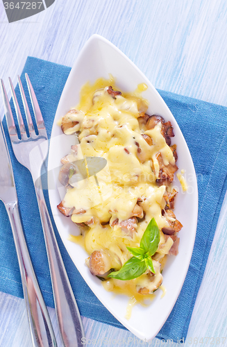 Image of fried meat with mushroom and cheese