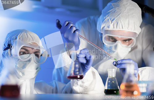 Image of close up of scientists making test in lab