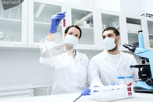 Image of young scientists making test or research in lab