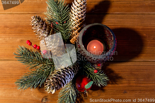 Image of christmas fir branch decoration and candle lantern