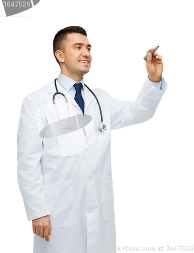 Image of smiling male doctor writing something with marker