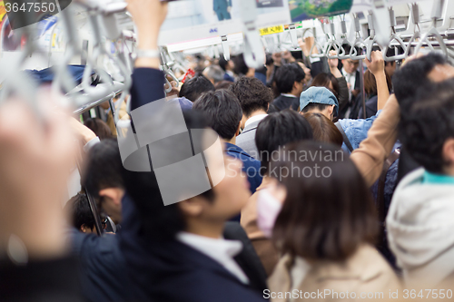 Image of Passengers traveling by Tokyo metro.