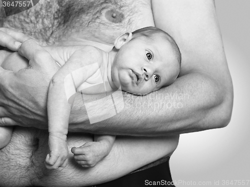 Image of Father holding baby