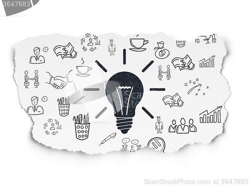 Image of Business concept: Light Bulb on Torn Paper background