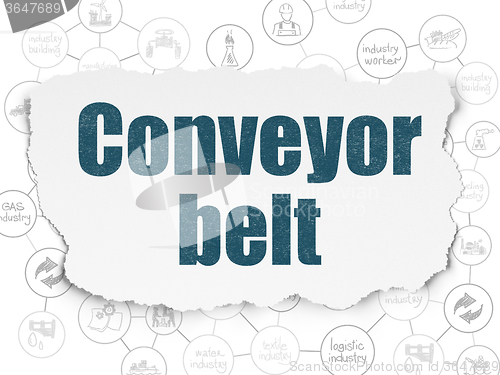 Image of Manufacuring concept: Conveyor Belt on Torn Paper background