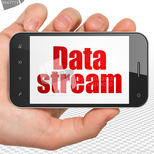 Image of Data concept: Hand Holding Smartphone with Data Stream on display