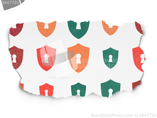 Image of Protection concept: Shield With Keyhole icons on Torn Paper background