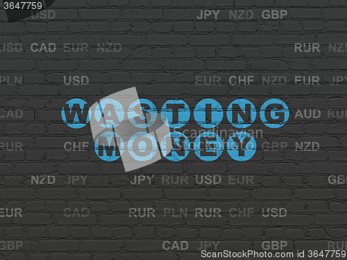 Image of Money concept: Wasting Money on wall background