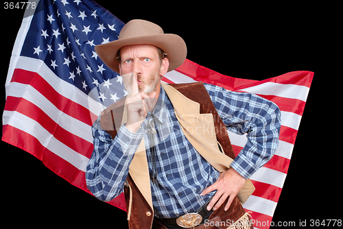 Image of Hushing senior cowboy with American flag