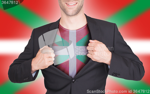 Image of Businessman opening suit to reveal shirt with flag
