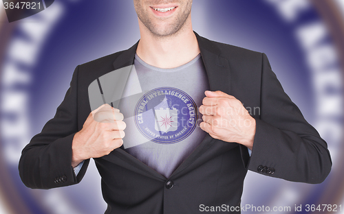 Image of Businessman opening suit to reveal shirt with flag