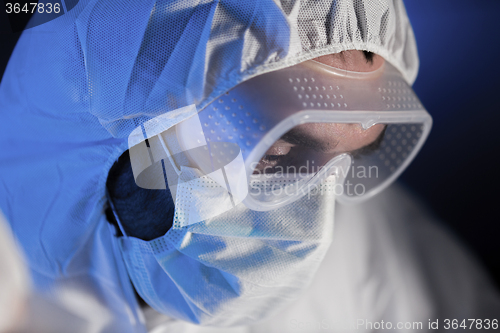 Image of close up of scientist face in chemical lab