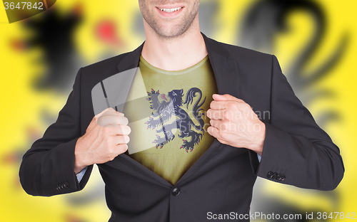 Image of Businessman opening suit to reveal shirt with flag