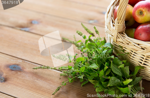 Image of close up of melissa and basket with apples