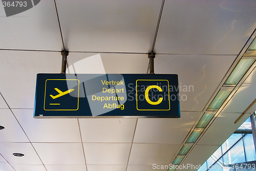 Image of Multilingual Airport Departure Sign