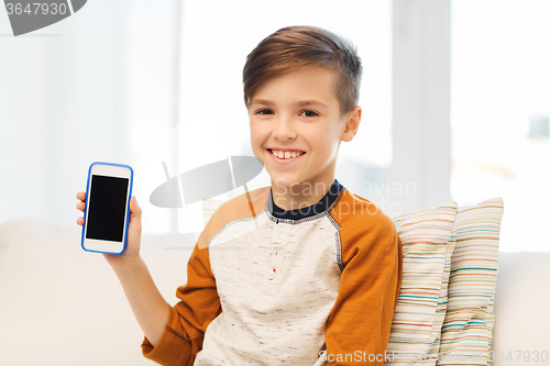 Image of smiling boy with smartphone at home