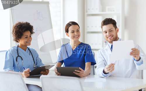 Image of group of happy doctors meeting at hospital office