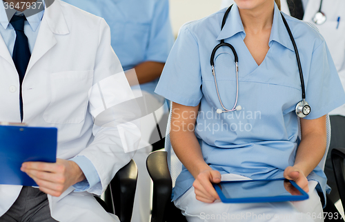 Image of close up of happy doctors at seminar or hospital