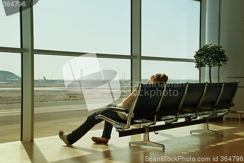 Image of Lonely girl waiting in airport