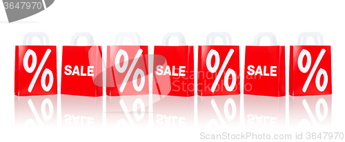 Image of many red shopping bags with sale and percentage