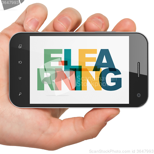 Image of Learning concept: Hand Holding Smartphone with E-learning on  display