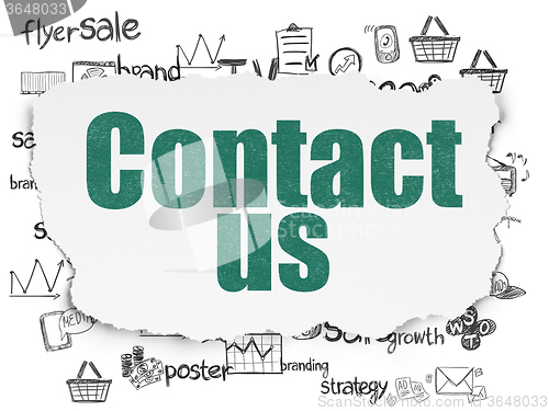 Image of Marketing concept: Contact Us on Torn Paper background