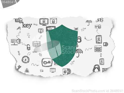 Image of Security concept: Shield on Torn Paper background