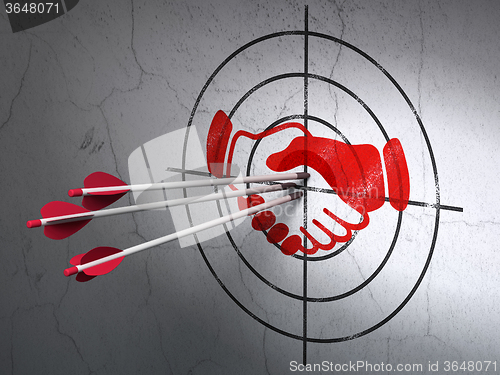 Image of Finance concept: arrows in Handshake target on wall background