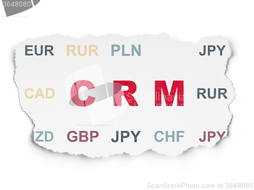 Image of Business concept: CRM on Torn Paper background