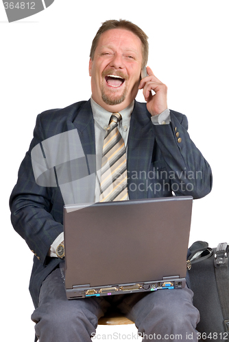 Image of Laughing businessman gets good news