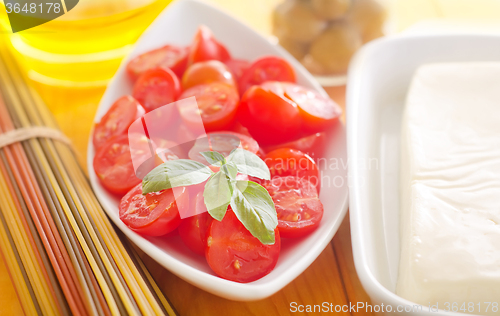 Image of cheese, pasta and tomato