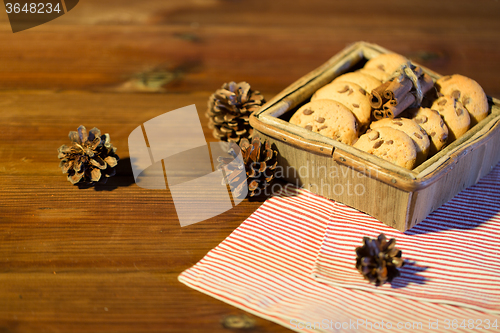 Image of close up of christmas oat cookies on wooden table